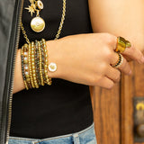 stretch ball bracelet with enamel hamsa disc charm