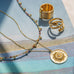 gold plated delicate chain with sundial pendant