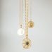 gold plated delicate chain with sundial pendant