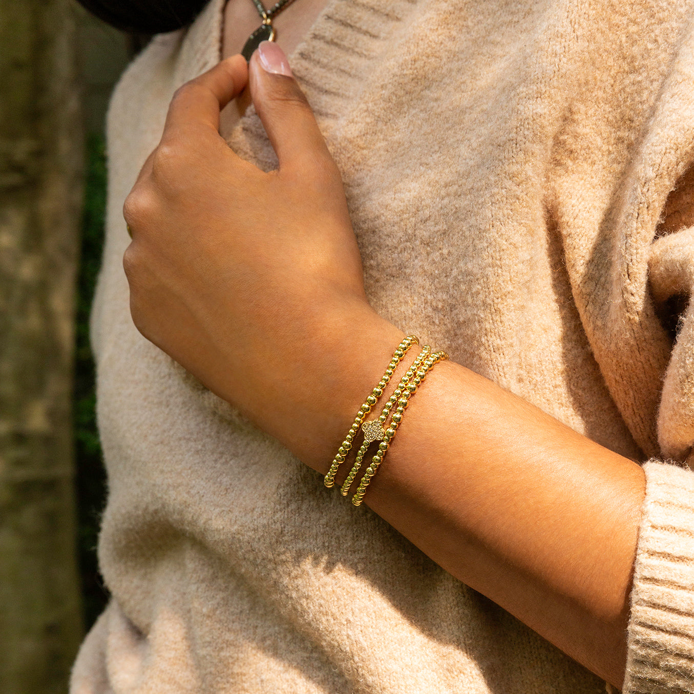 brass ball bracelet with pave clover charm