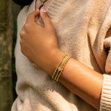 brass ball bracelet with pave clover charm
