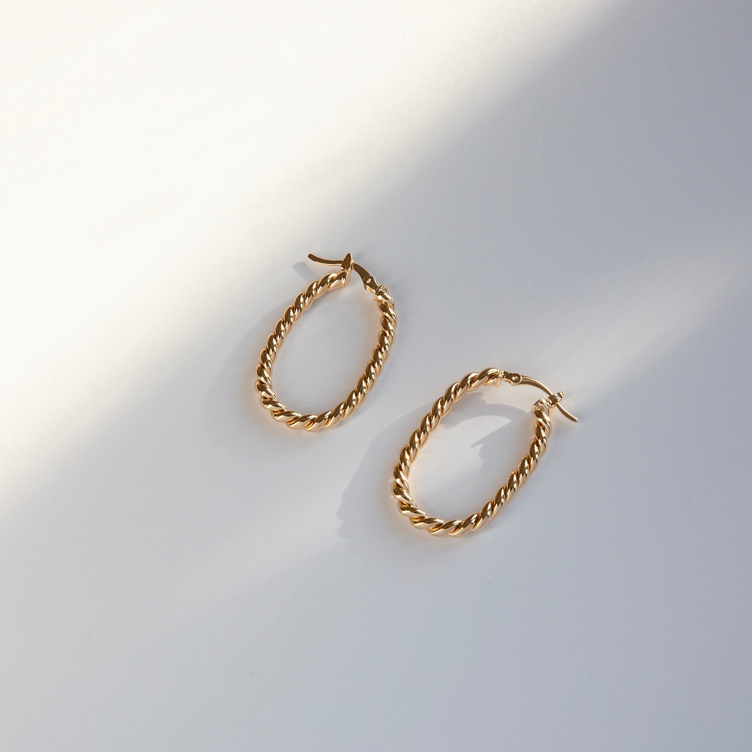 gold plated twisted oval hoop earring