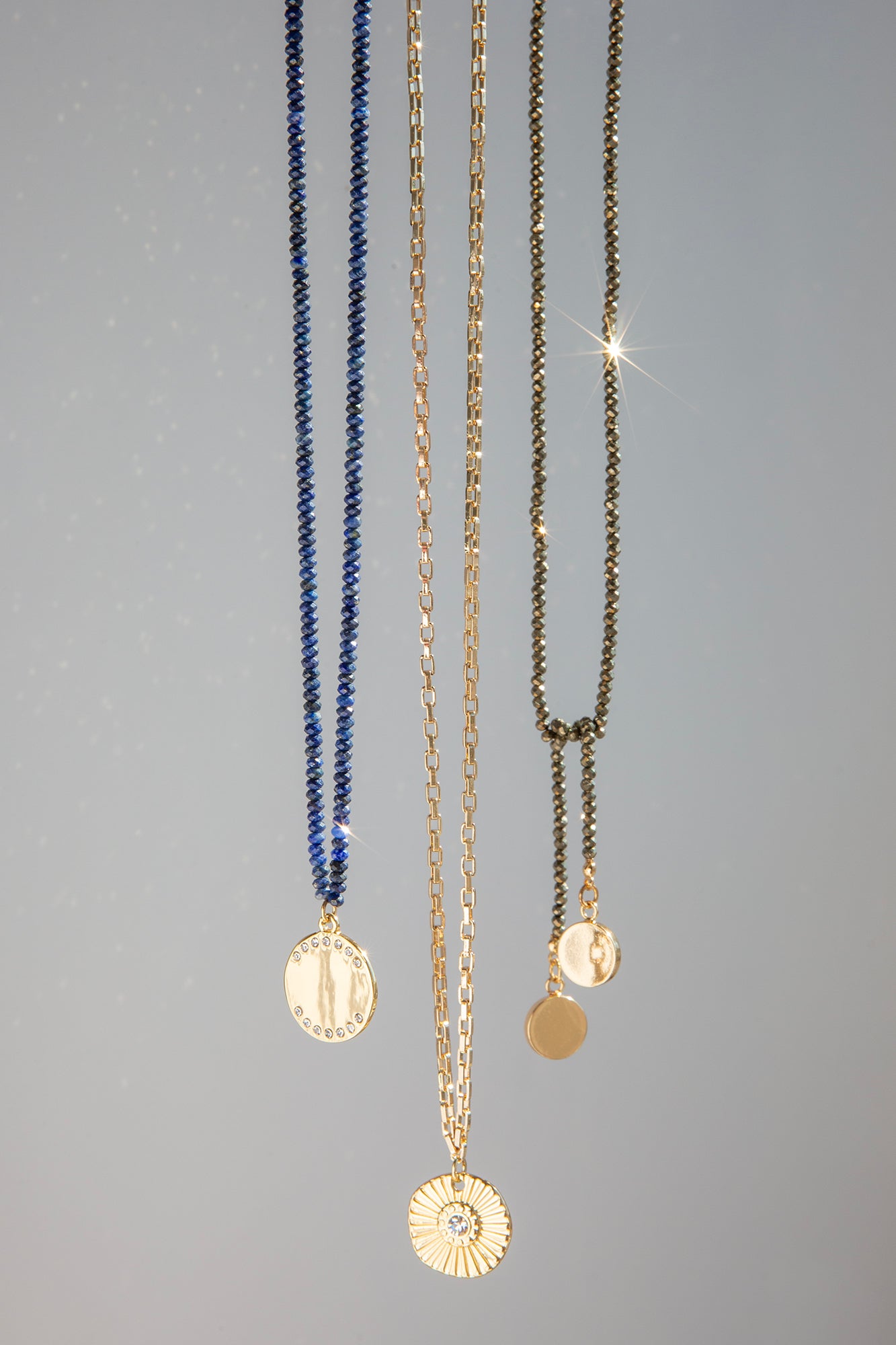 box chain necklace with ridged coin crystal charm